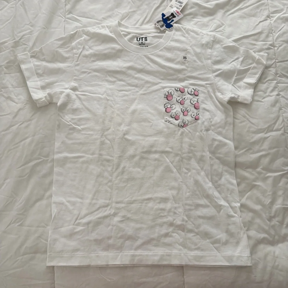 KAWS White Tee with Patterned Pocket XS - Picture 1 of 4